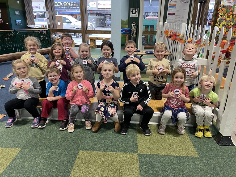 Preschool trip to Otter Cove Museum-- Children posing and smiling for a photo at their field trip.