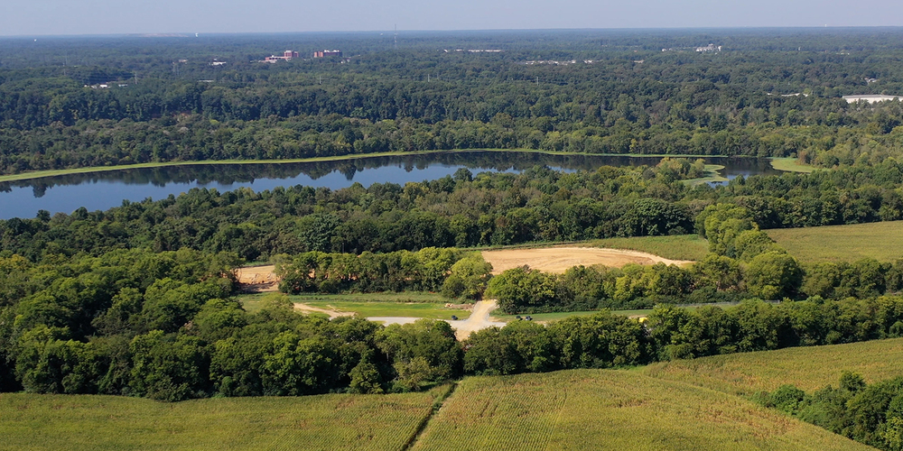 The site of the future Living Building in Varina, surrounded by trees and the James River.