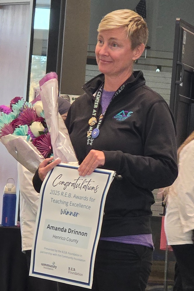 Drinnon Accepts R.E.B. award