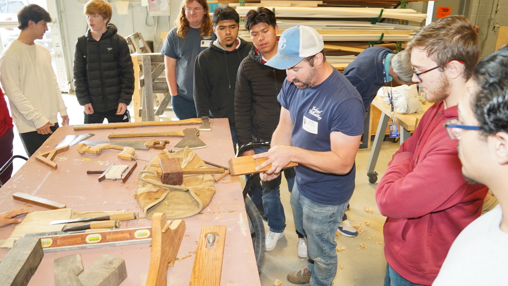 A historical tradesman shows off his skills to our trade students.