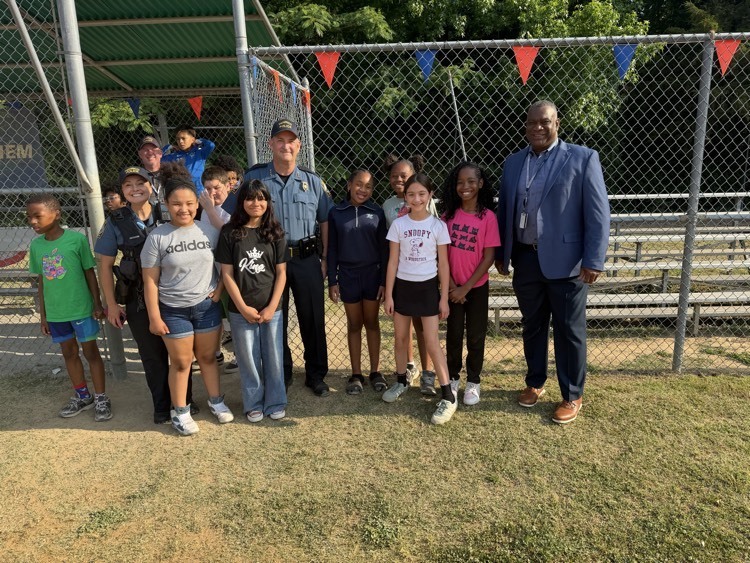 chief of police showing to kickball game