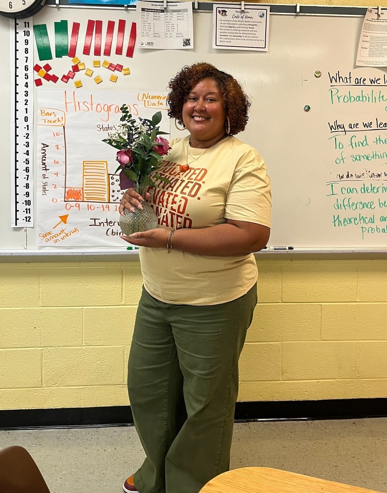 Nakia-Lewis-holds-flowers-after-being-named-Teacher-of-the-year
