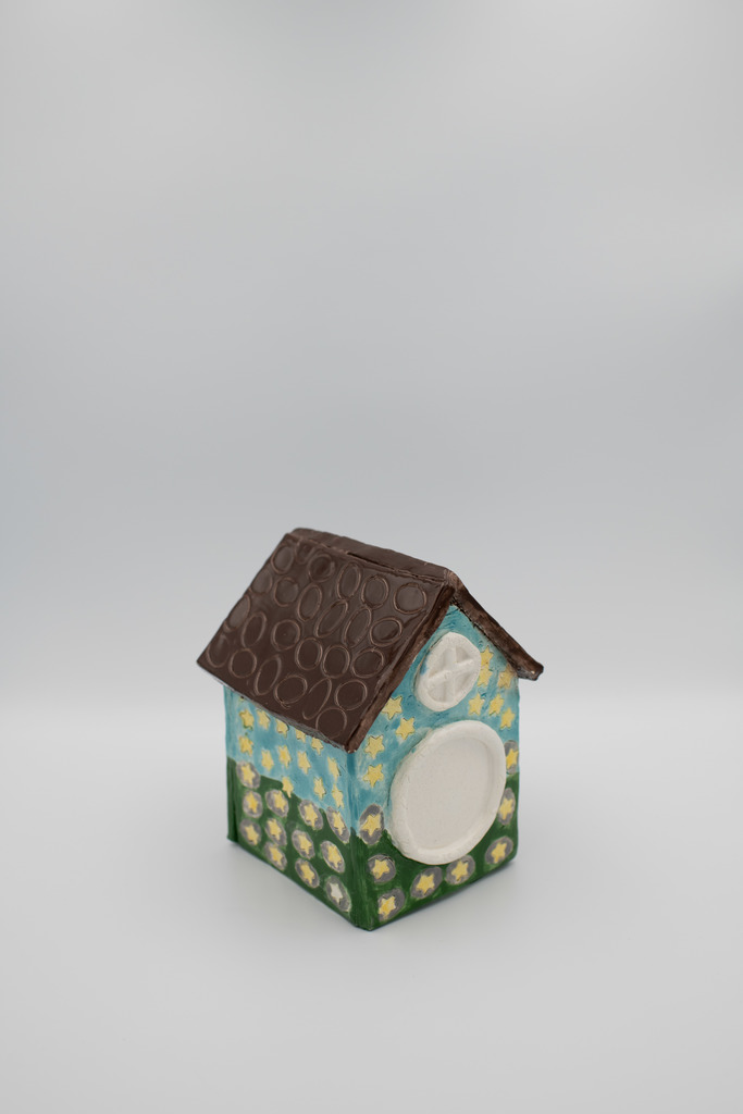 Images of fairy houses created by ceramics students