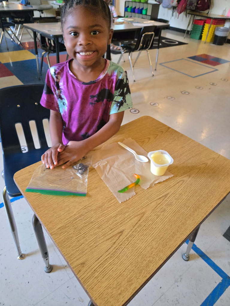 Kindergarten students practice sequencing with dirt pudding.