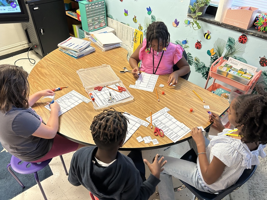 Students work together at the table.