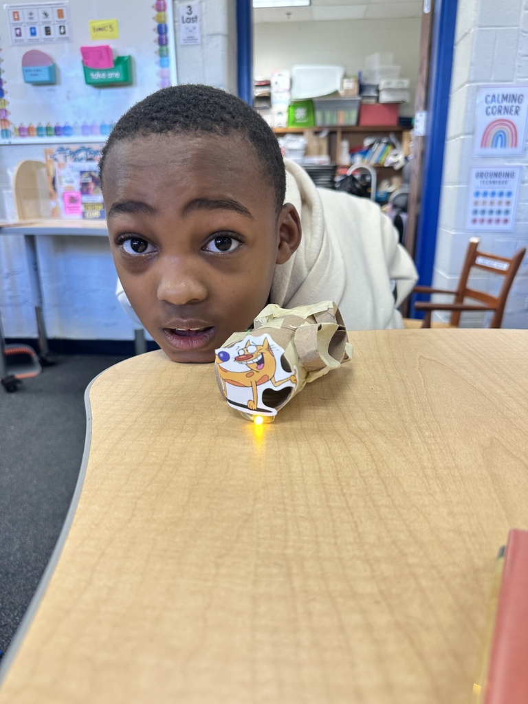 Student shows a light on a train.