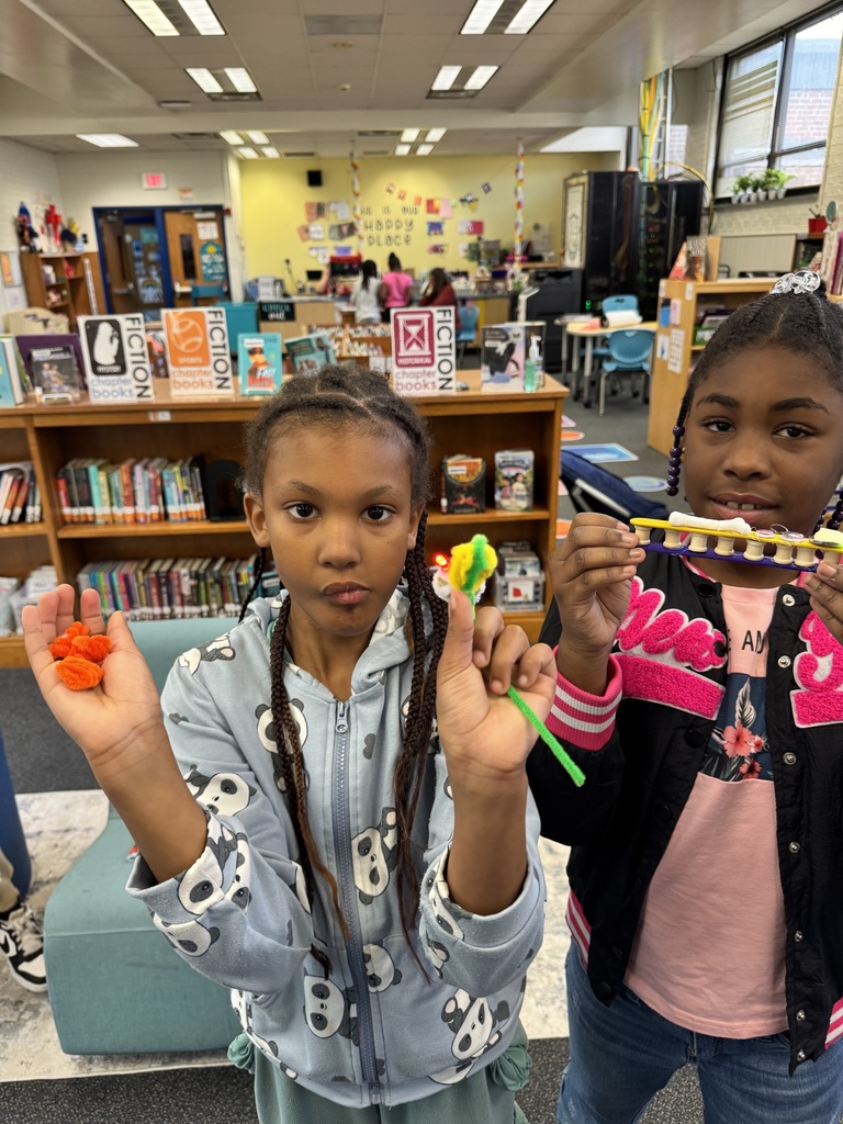 Students show off he lights they constructed.