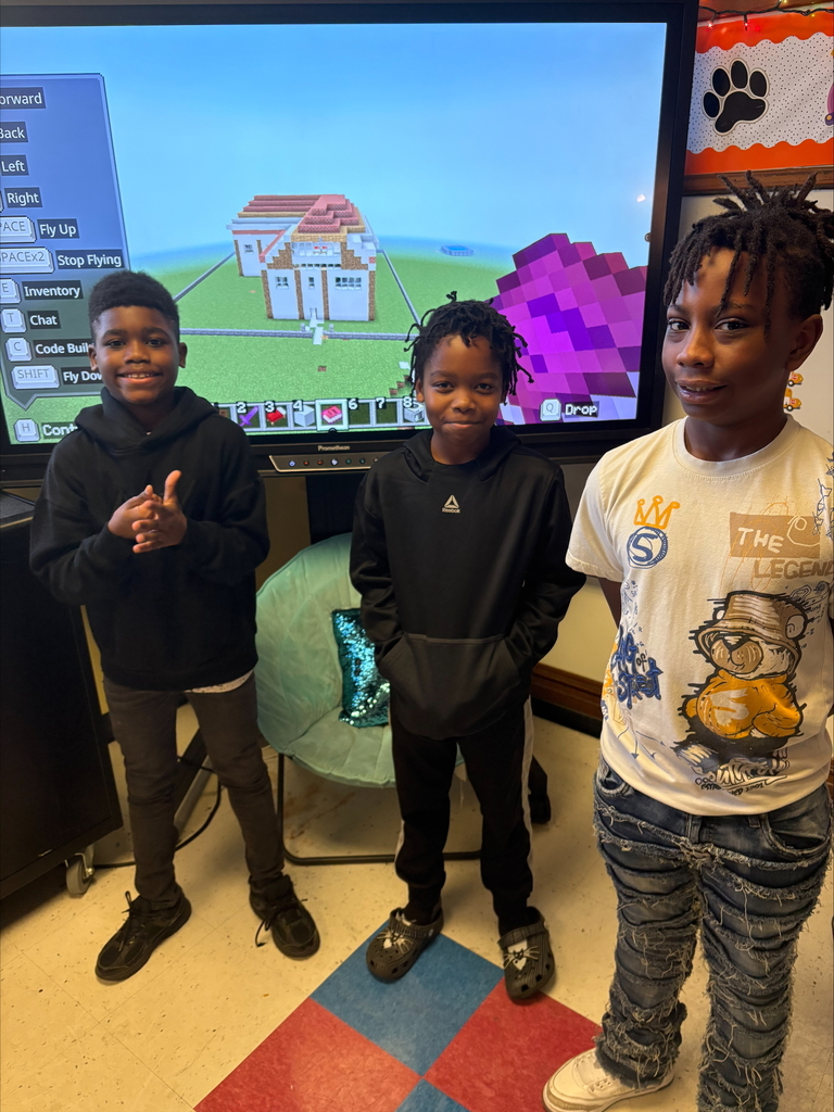 Students share their presentation within Minecraft.