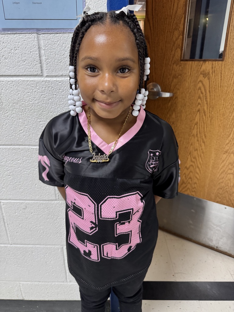A student shows off her jersey.