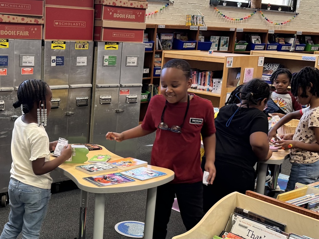 Students explore the tables to find an item to take home.