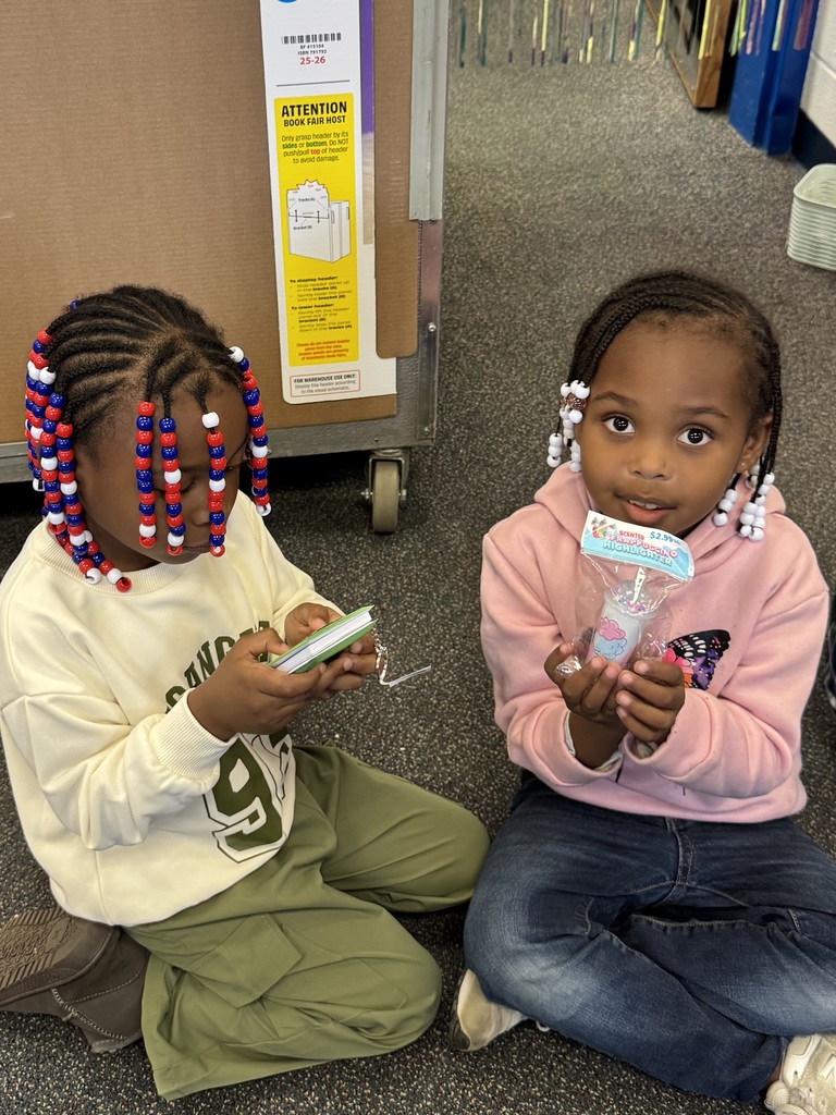 Students show two items that they chose during Wish Day.