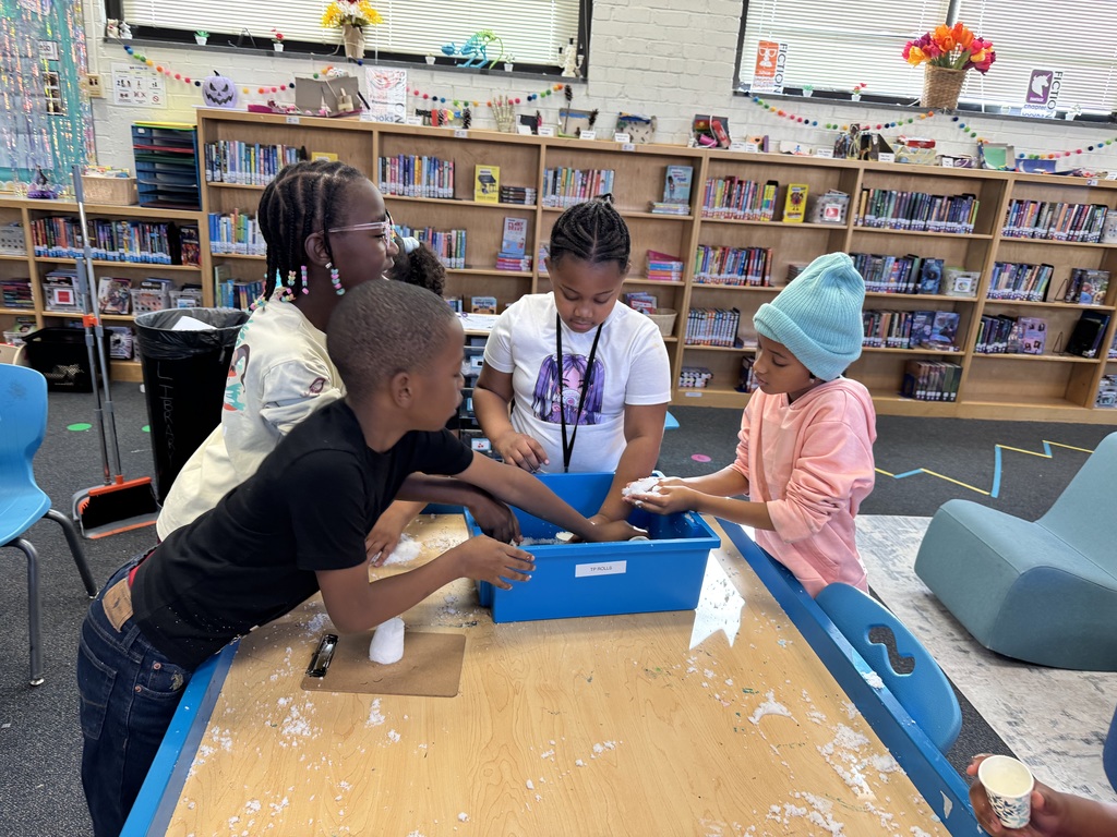 Students collaborate at the fake snow table.