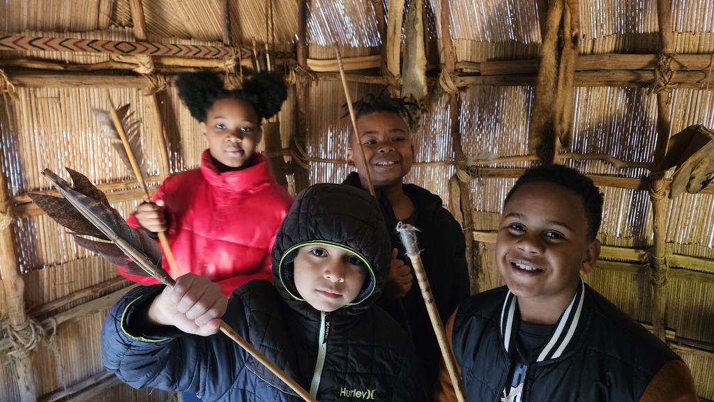 Students show off arrow replicas.