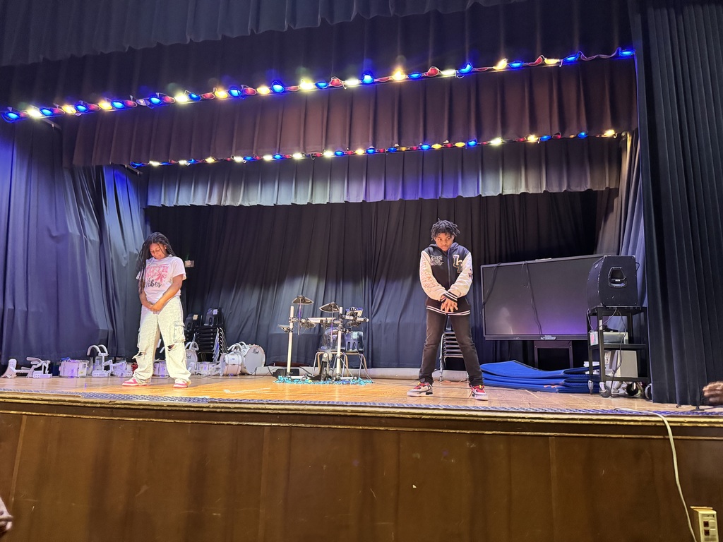 Two students prepare for their dance.