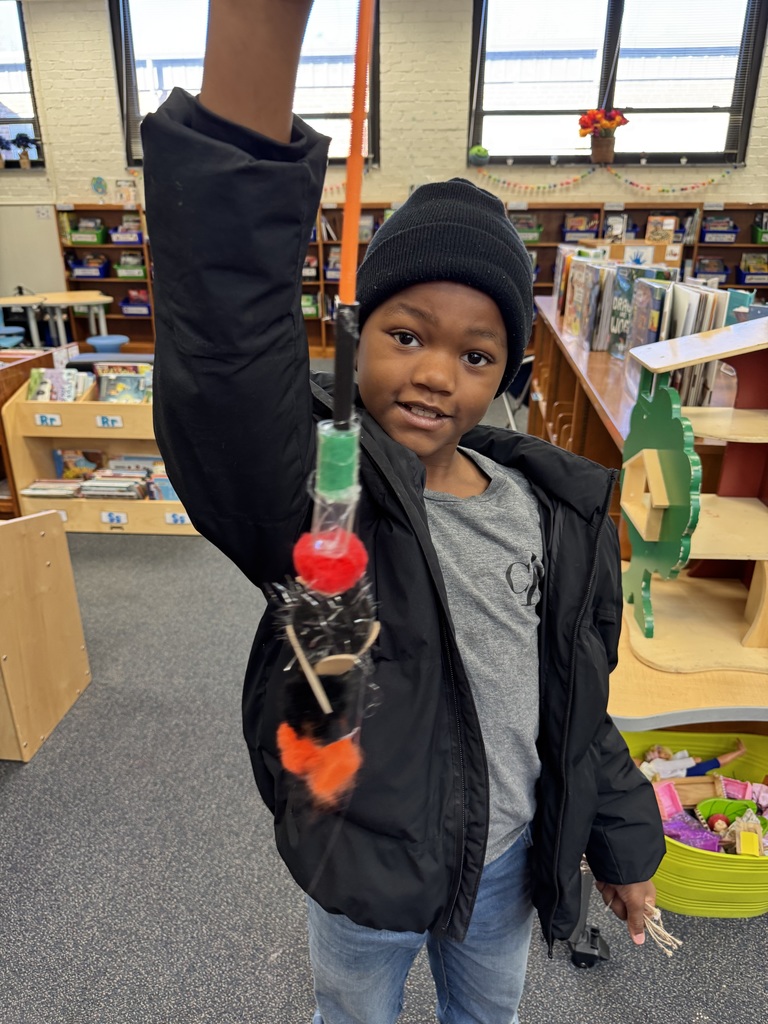 A student shows off his creation.