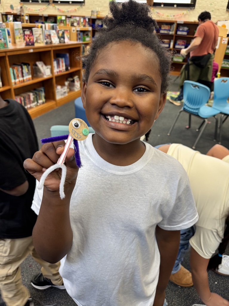 Student creates a character out of straws, pipe cleaners, and wood.