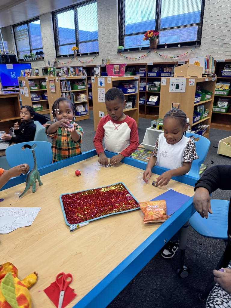 Kindergarten students use their slime after shopping the cart.
