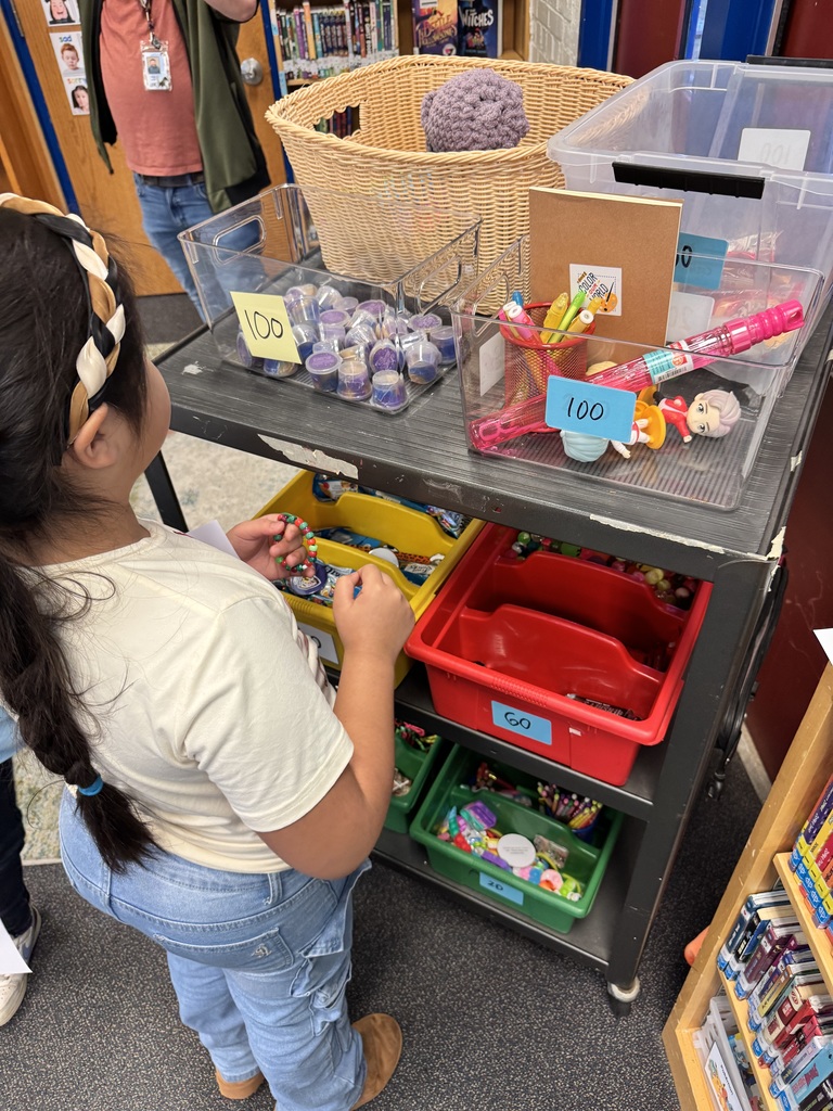 Student browses items for sale at the ROAR cart.