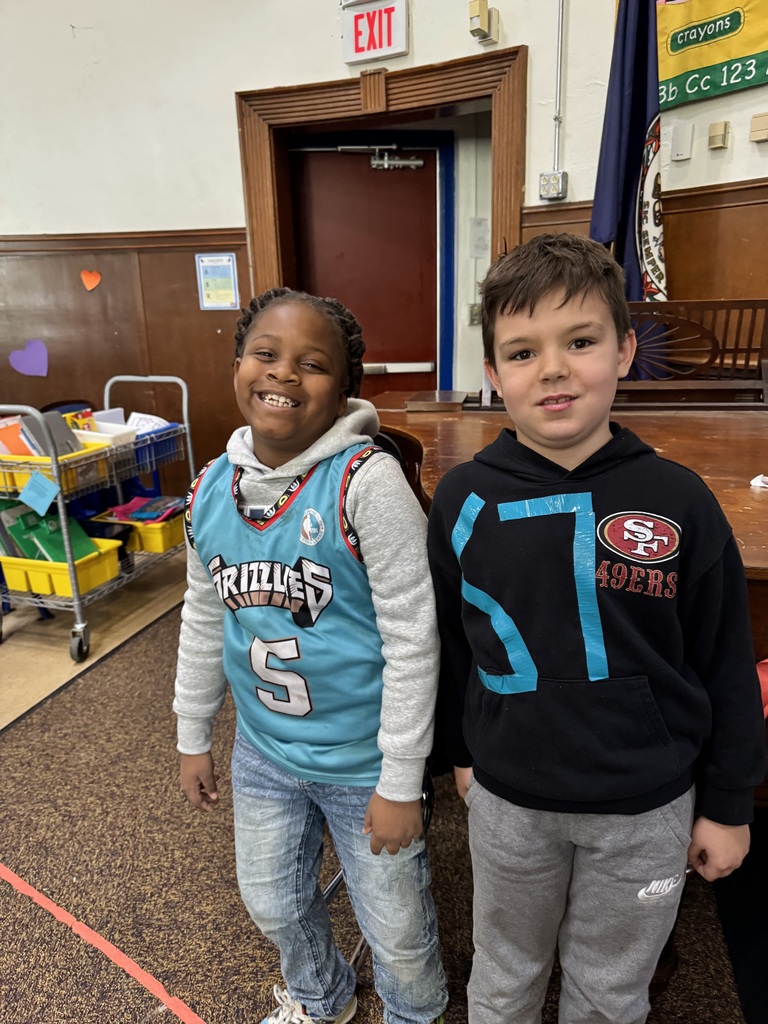 Two students show off before the spelling bee.