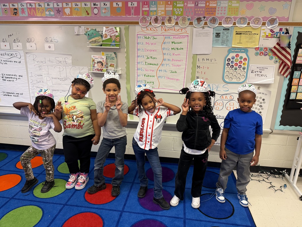 Students show of their 67 days hats.