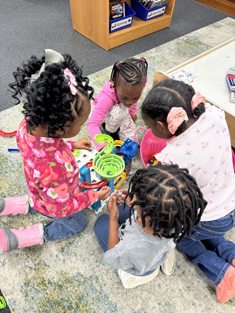 Students build a marble run together.