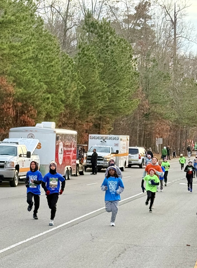 Students run one mile in a local rice.