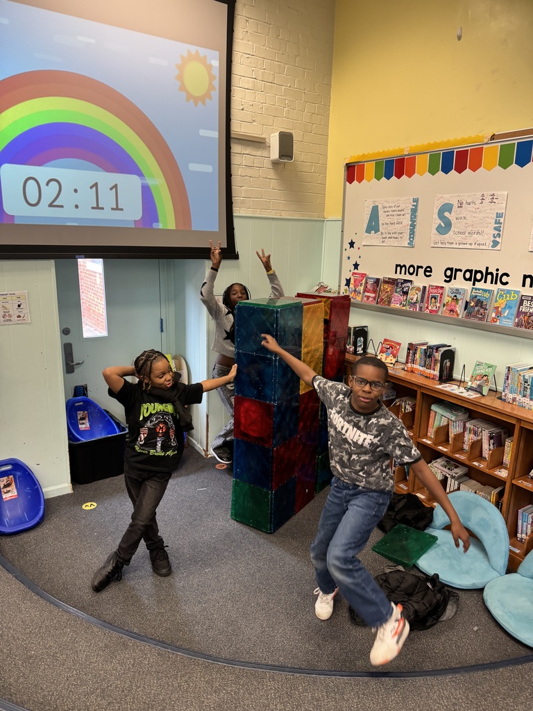 Students show off their building.