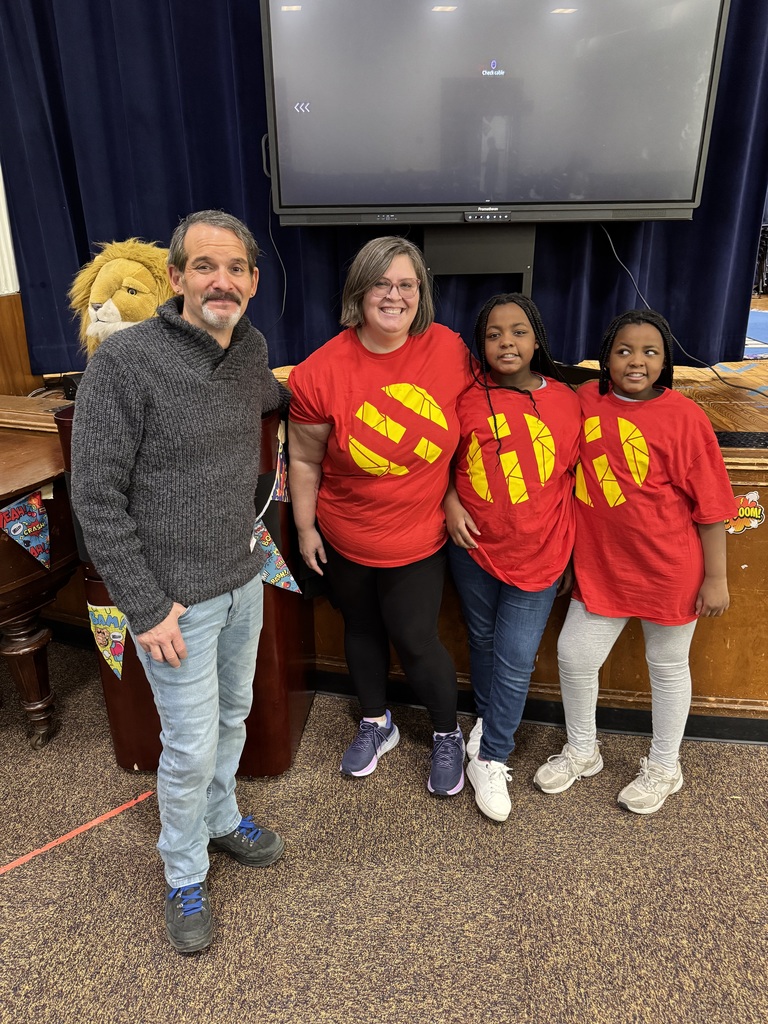 Judd Winick stands with librarian and students.