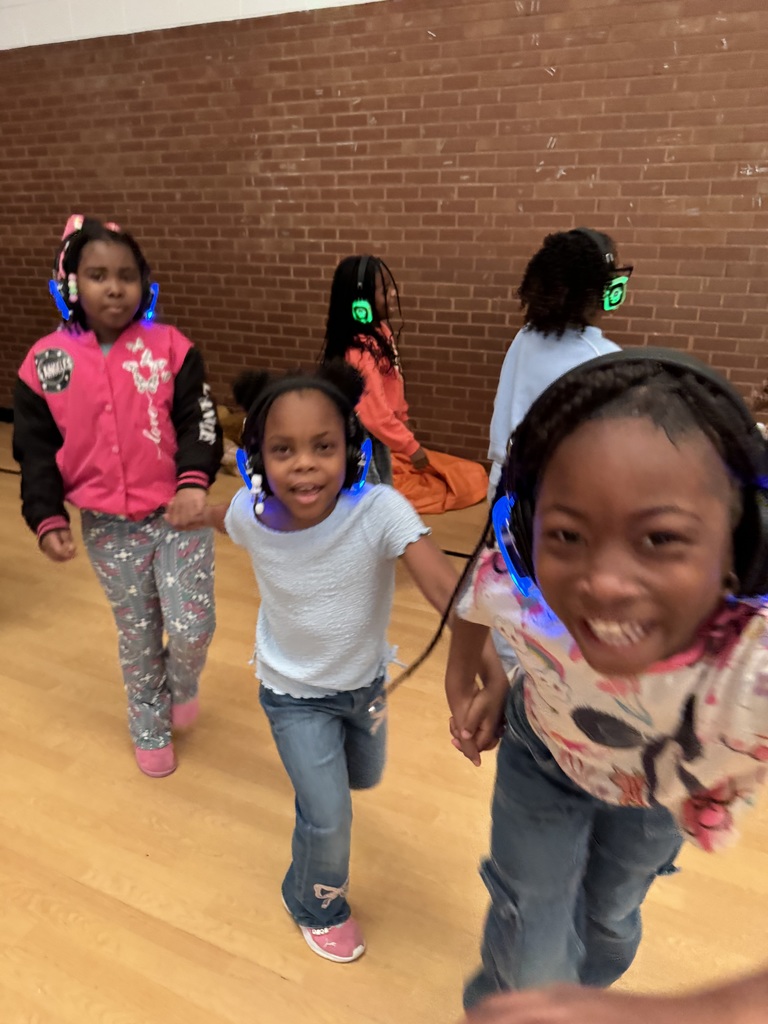 Students dance and smile together.