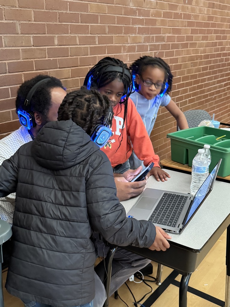 Students select songs with the music teacher.