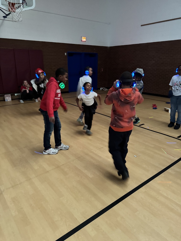 Students dance with headphones on.