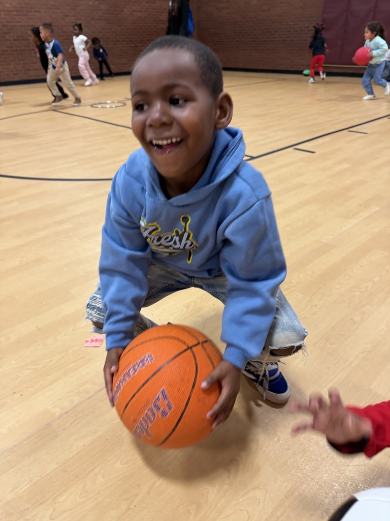 Student bounces a basketball.