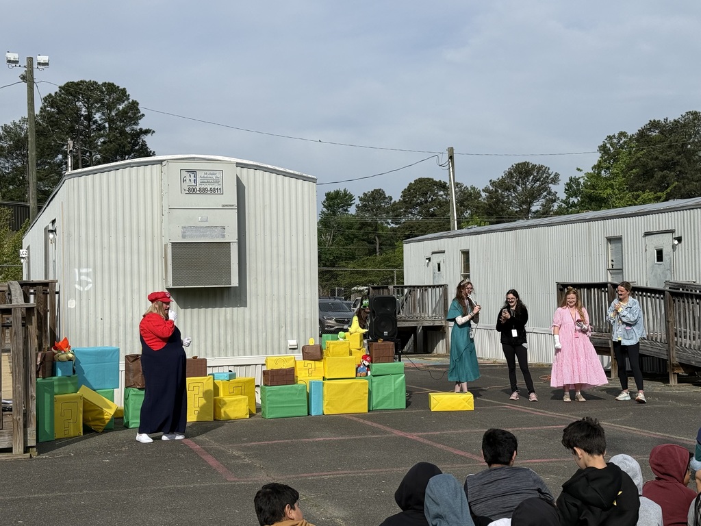 Staff and students celebrating the Mario way!