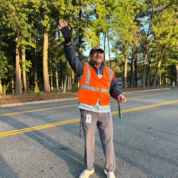 school security officer directing traffic