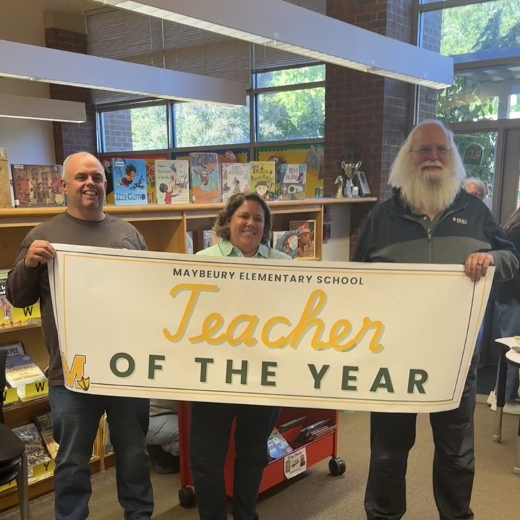 picture of Mrs. Robertson, the teacher of the year with her dad and husband 