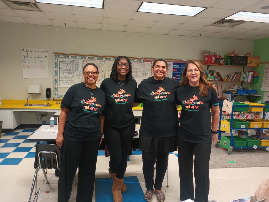 The first grade team celebrates together.