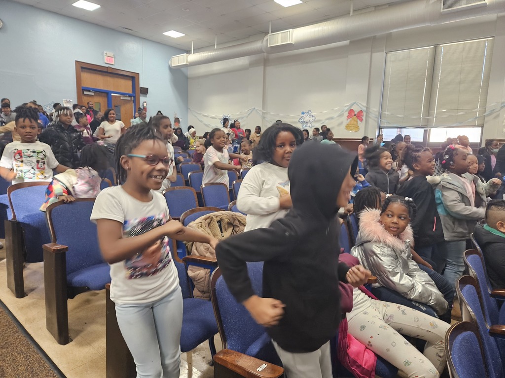 Students dance with big smiles.