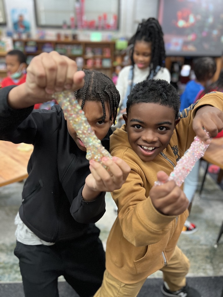 Third graders pose with their slime.