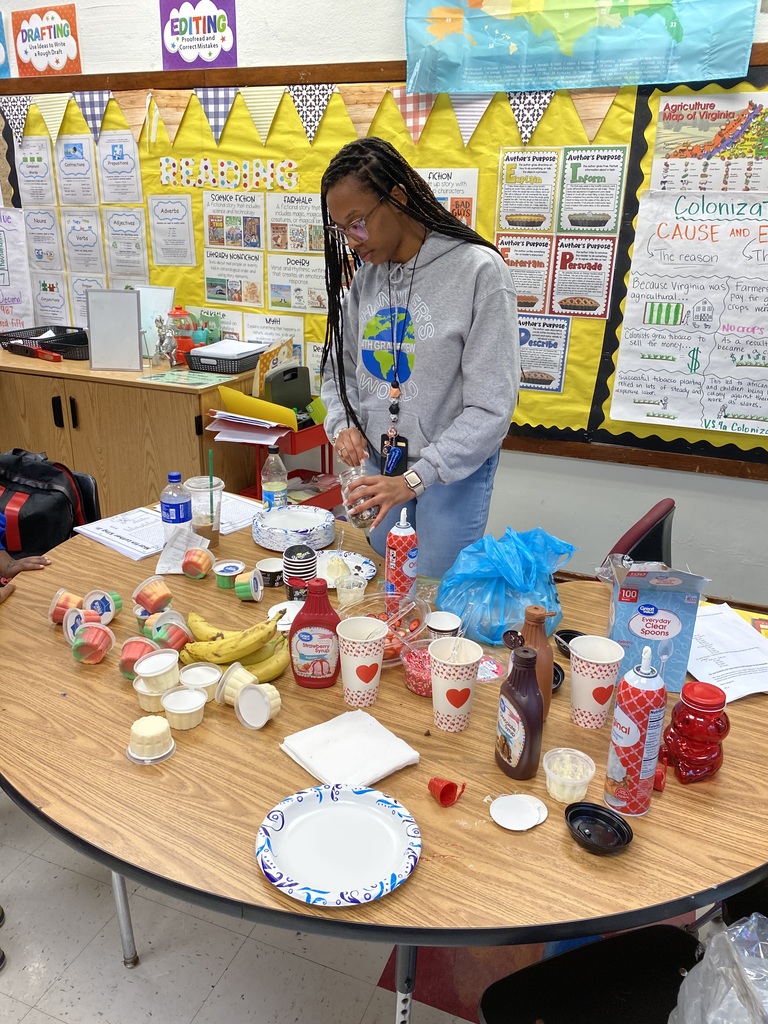 Ms. Chandler prepares a sundae bar.