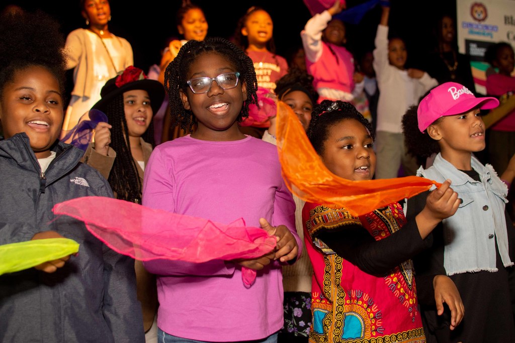 3rd grade students perform with scarves.