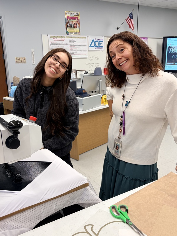 graphics studetn takes on a heat press project from our principal at ACE