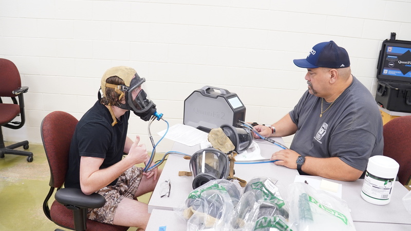 student getting fitted for their air mask.