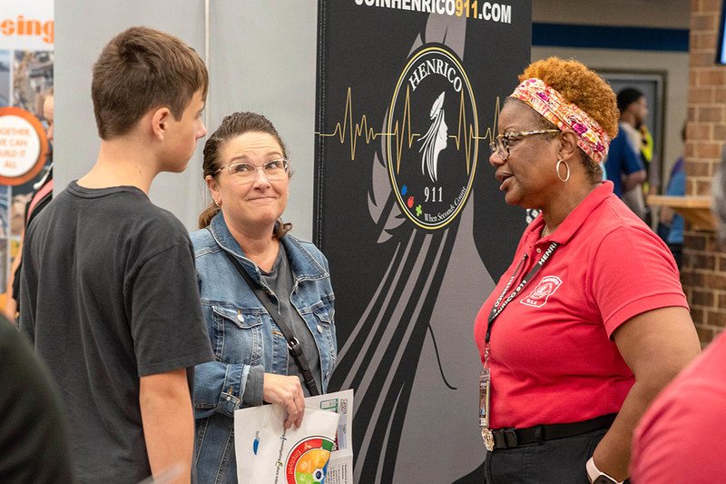 Attendees talk with representatives of local employers at Henrico's Life-Ready Expo in 2024.