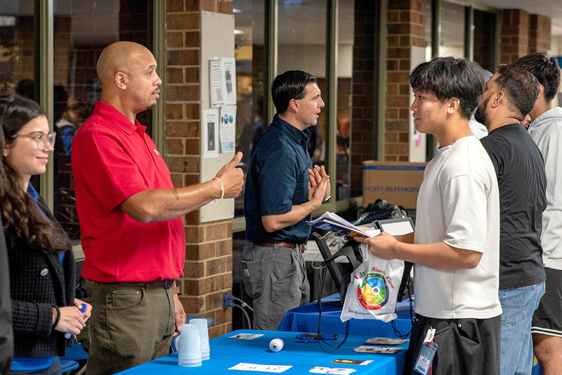 Attendees talk with representatives of local employers at Henrico's Life-Ready Expo in 2024.