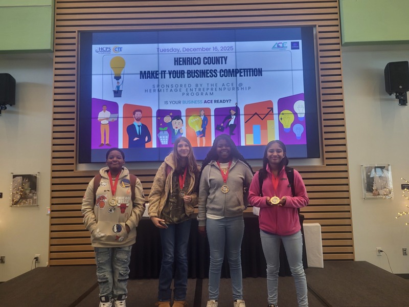 students in front of award screen