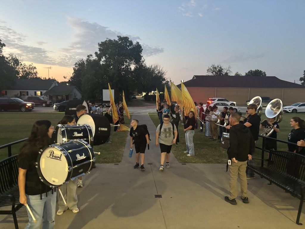 HHS Band and Football Players Greet Students at the Junior High!