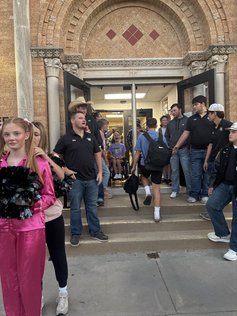 HHS Band and Football Players Greet Students at the Junior High!