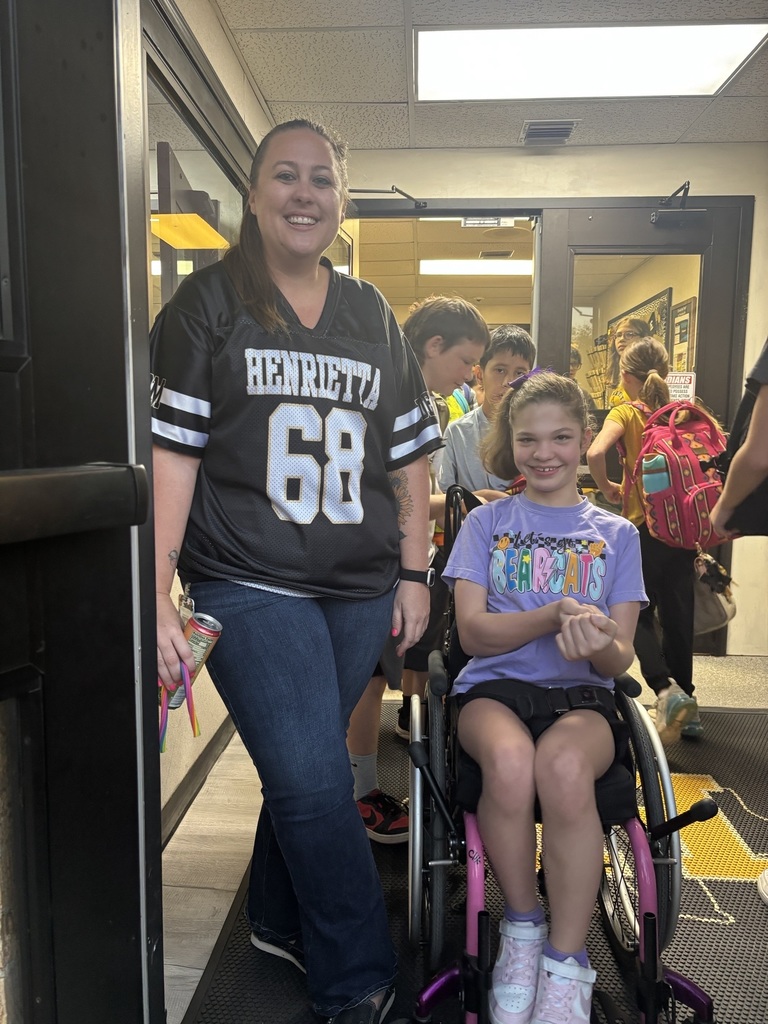 HHS Band and Football Players Greet Students at the Junior High!