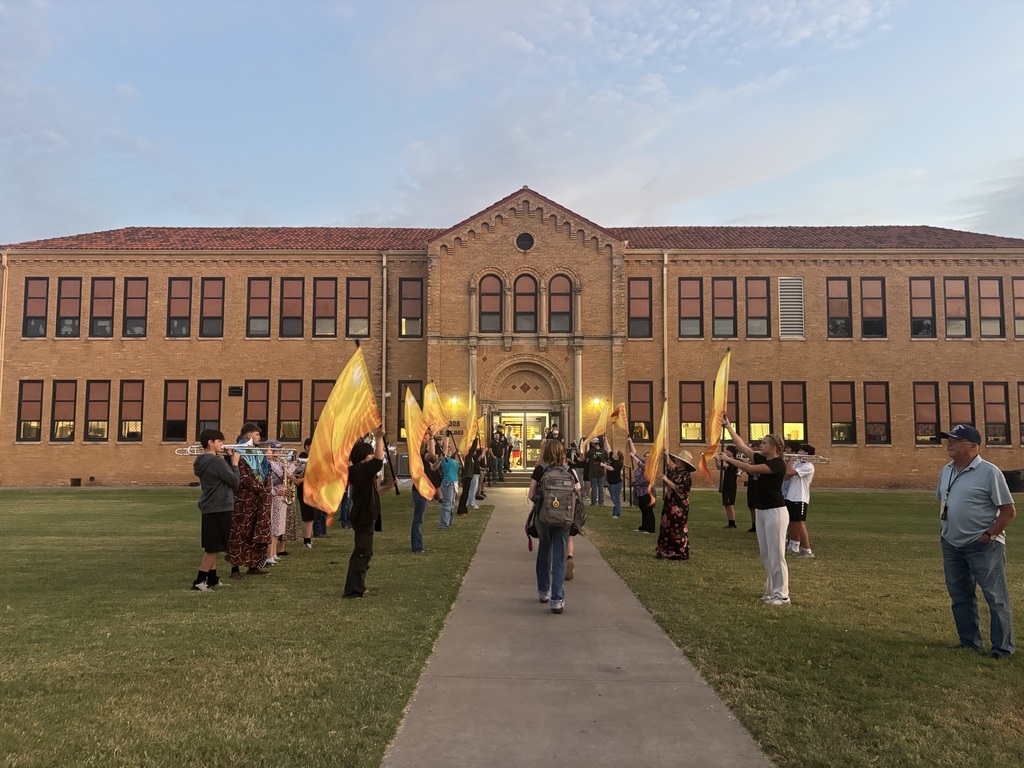 HHS Band and Football Players Greet Students at the Junior High!