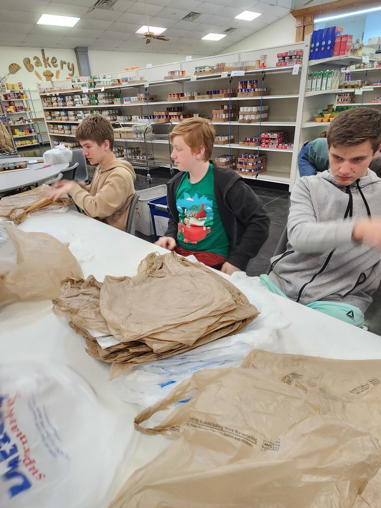 Henrietta Junior High students volunteering at the Food Pantry! Bearcats Give Back!